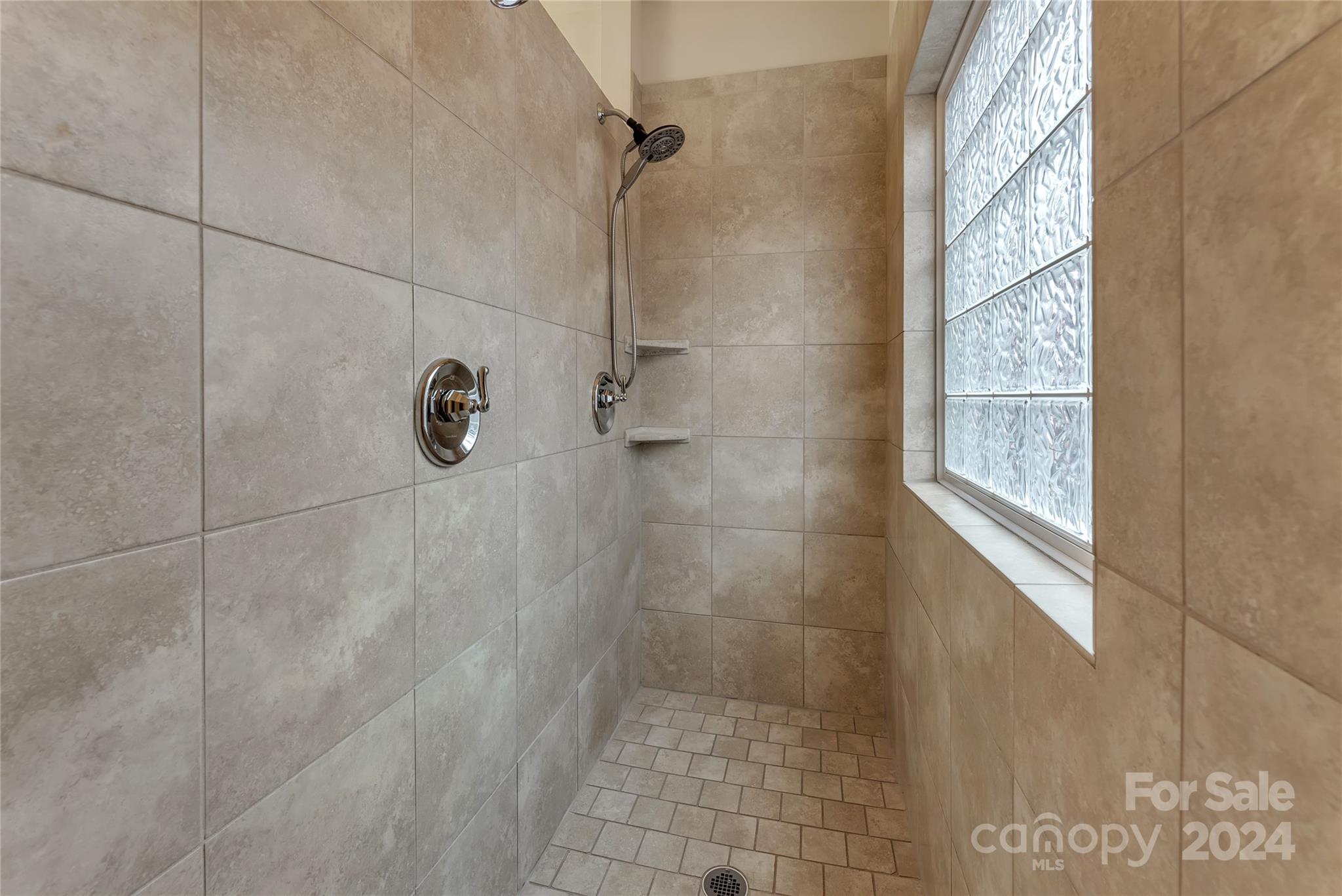 920 Millbrook Road Charlotte, NC 28211 - Photo 28 of 48 a bathroom with a shower