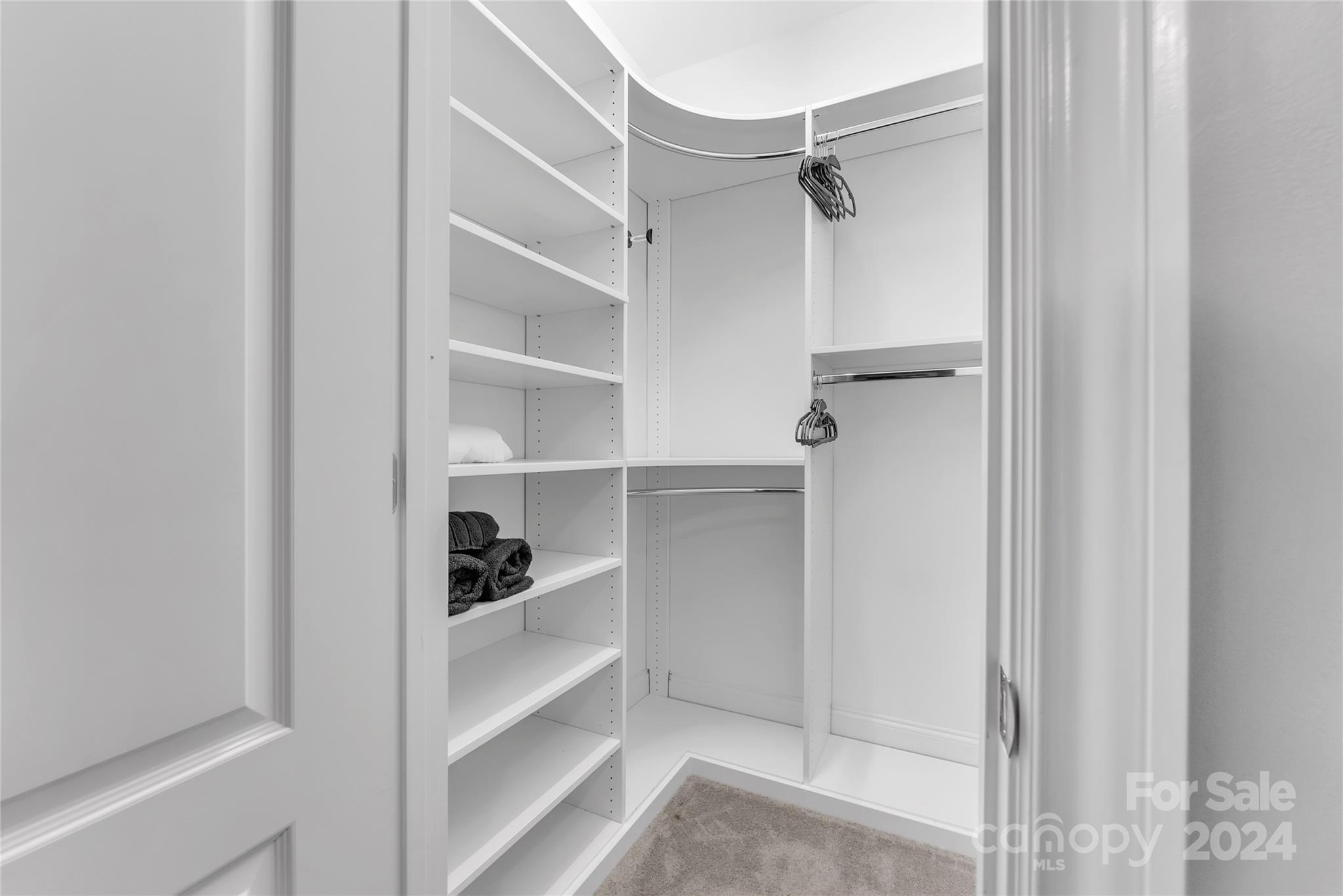 920 Millbrook Road Charlotte, NC 28211 - Photo 30 of 48 a view of walk in closet with empty racks