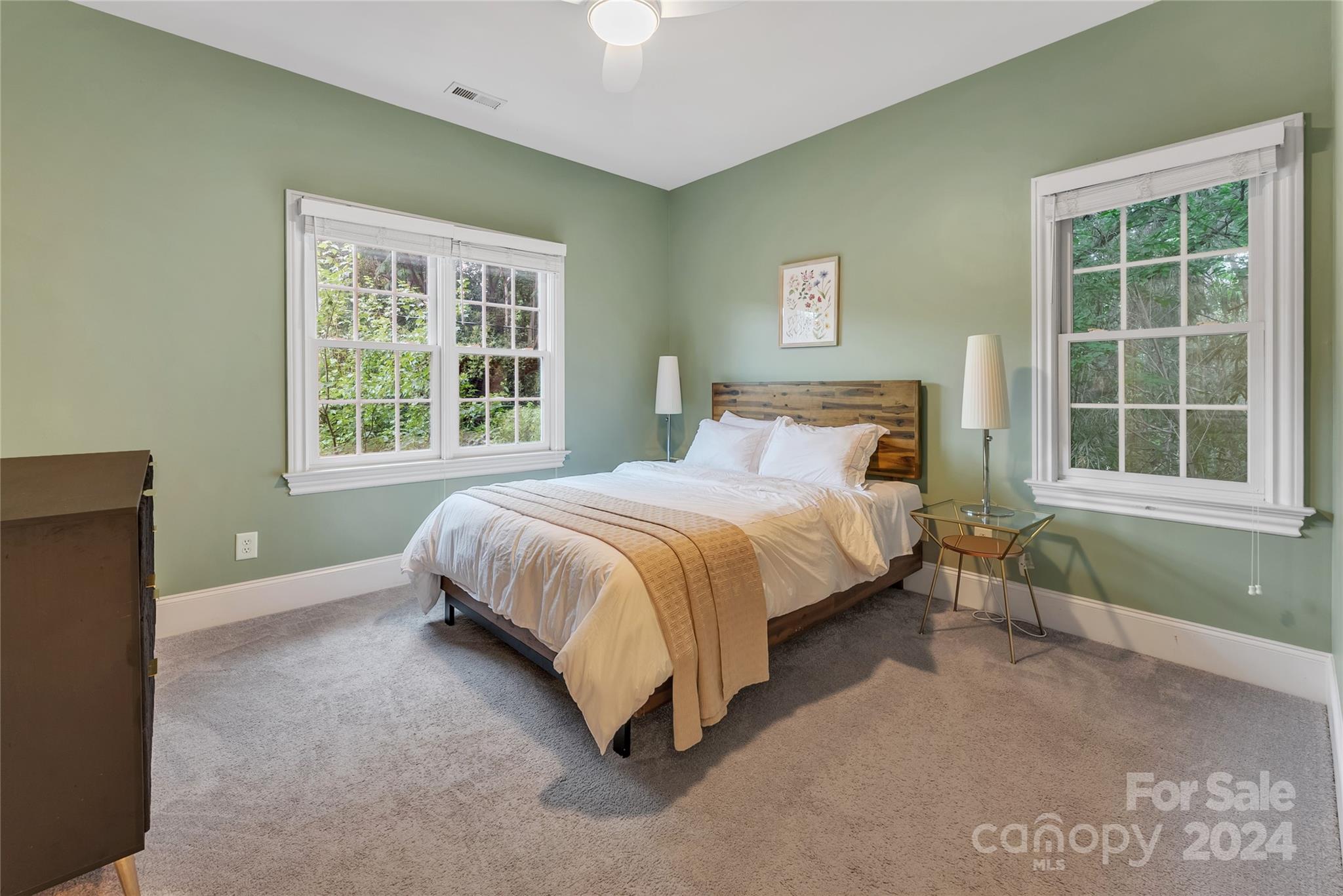 920 Millbrook Road Charlotte, NC 28211 - Photo 31 of 48 a bed sitting in a bedroom next to a window