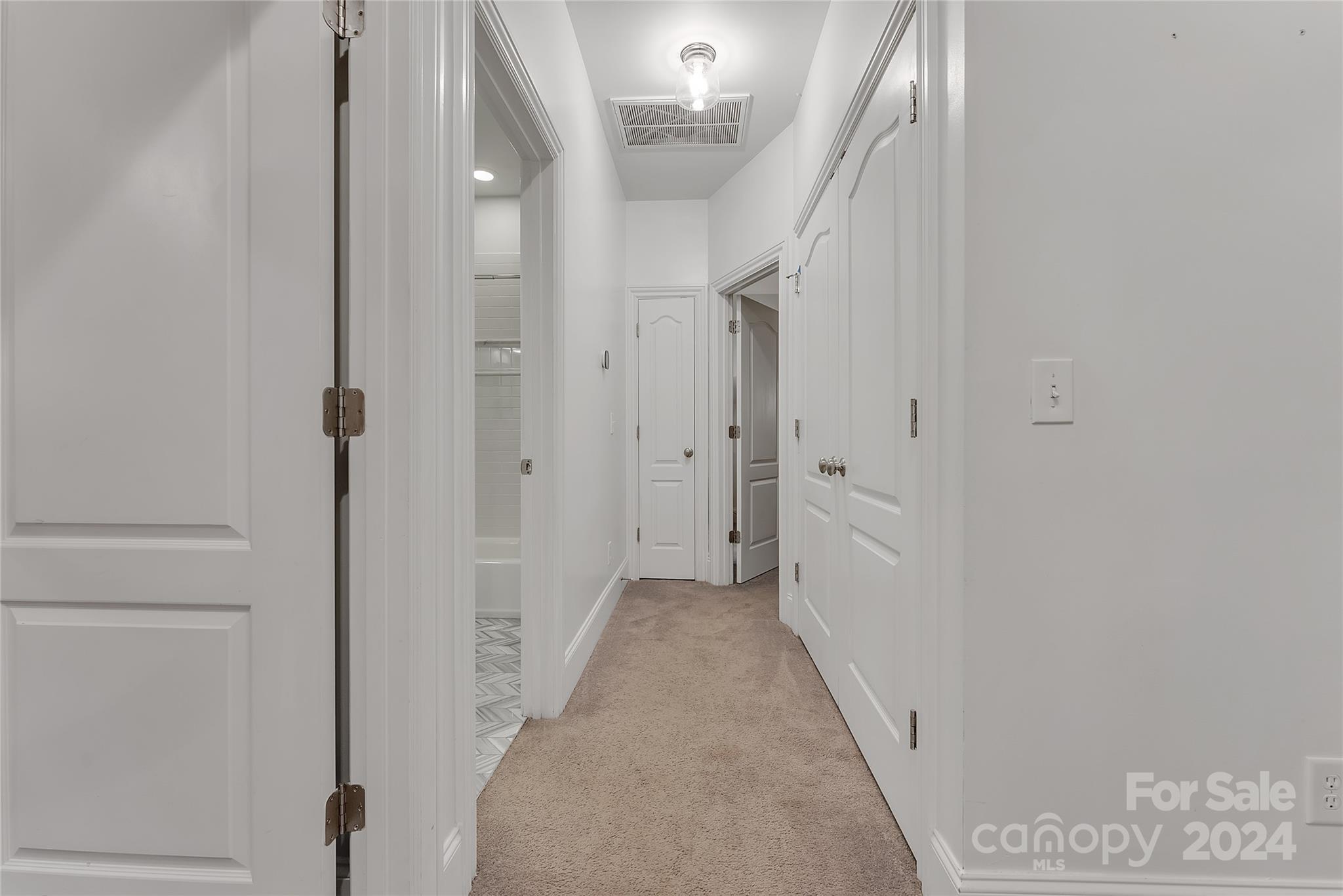 920 Millbrook Road Charlotte, NC 28211 - Photo 35 of 48 a view of a hallway with white walls