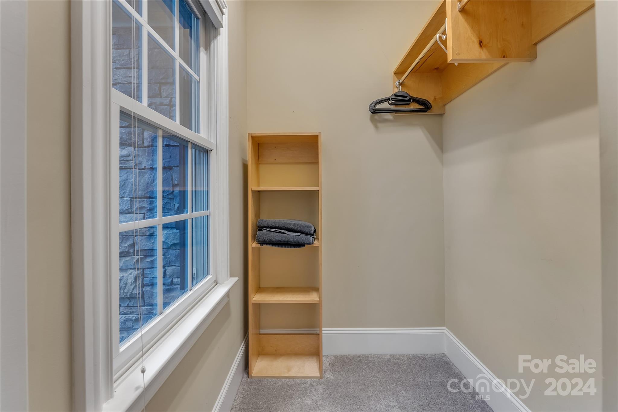 920 Millbrook Road Charlotte, NC 28211 - Photo 39 of 48 a view of walk in closet with clothes