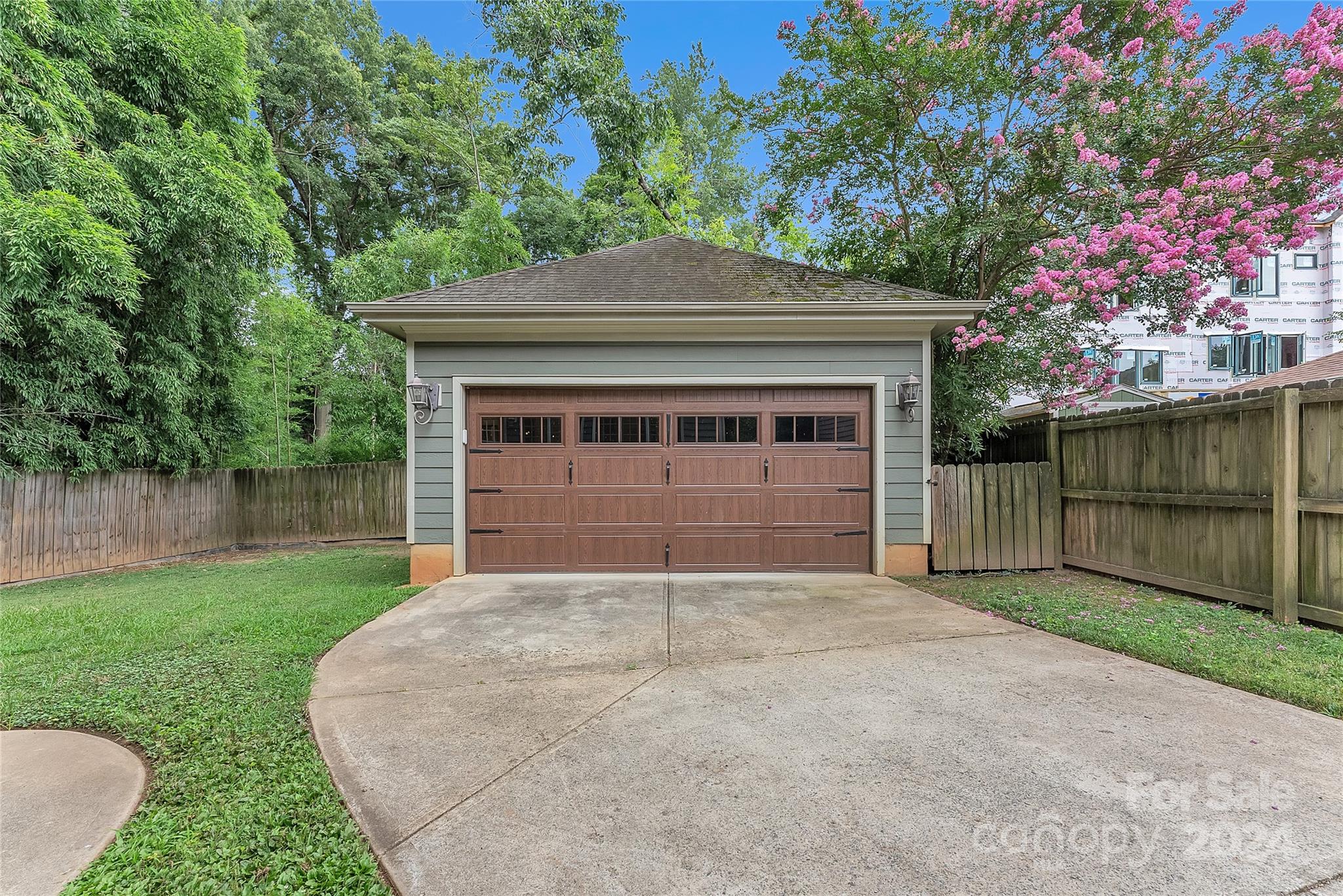 920 Millbrook Road Charlotte, NC 28211 - Photo 43 of 48 a front view of a house with yard and garage