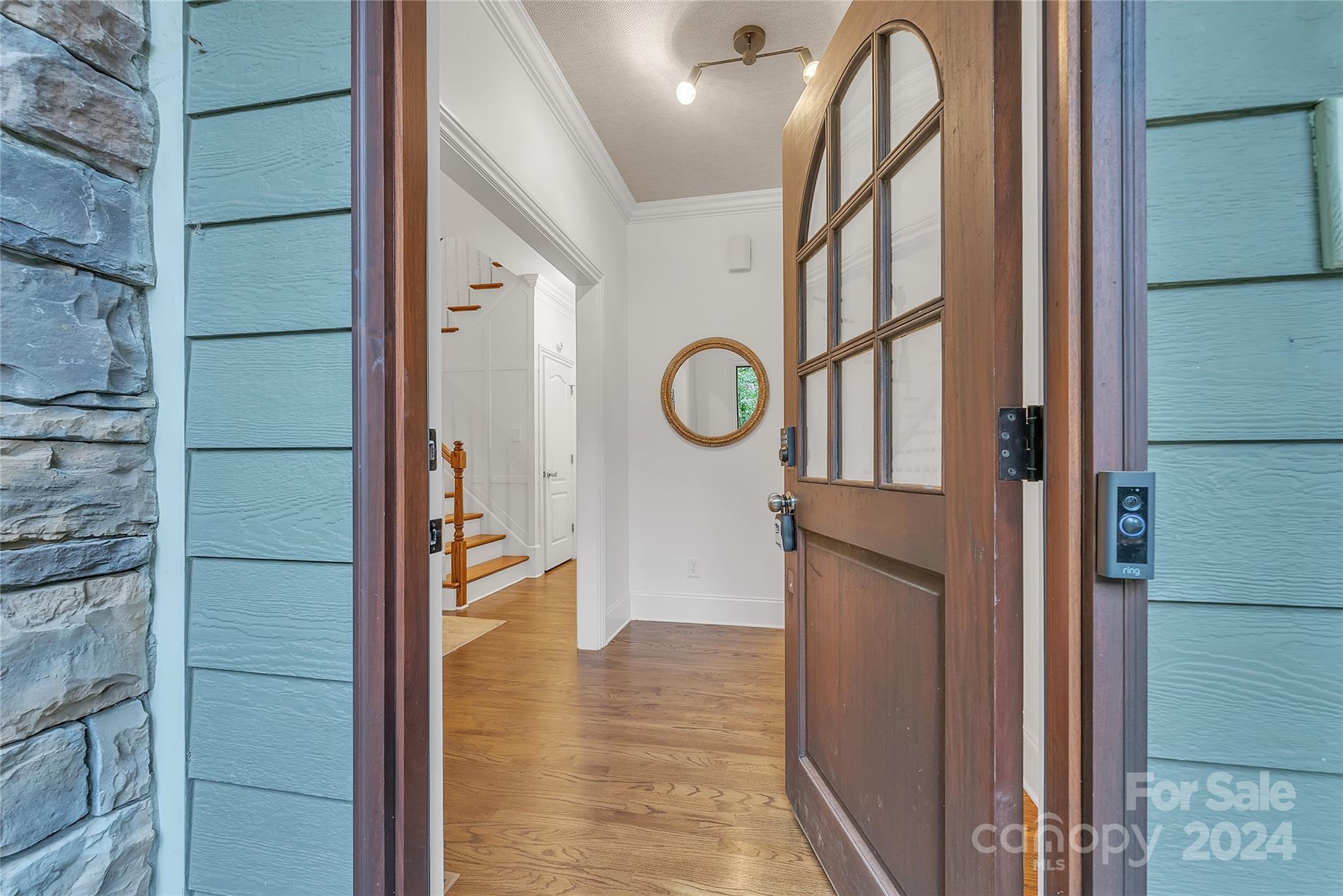 920 Millbrook Road Charlotte, NC 28211 - Photo 5 of 48 a view of a hallway with entryway wooden floor and door