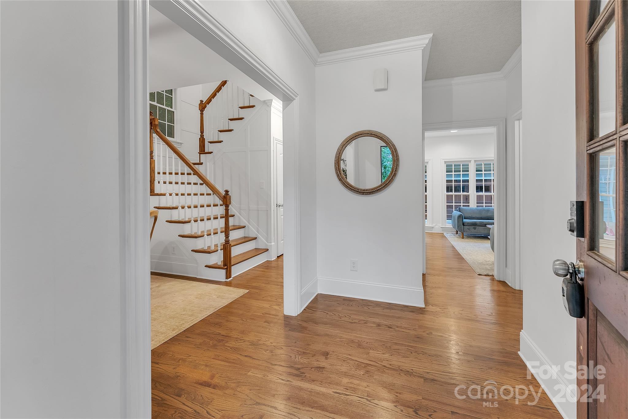 920 Millbrook Road Charlotte, NC 28211 - Photo 6 of 48 a view of a hallway with wooden floor and workspace