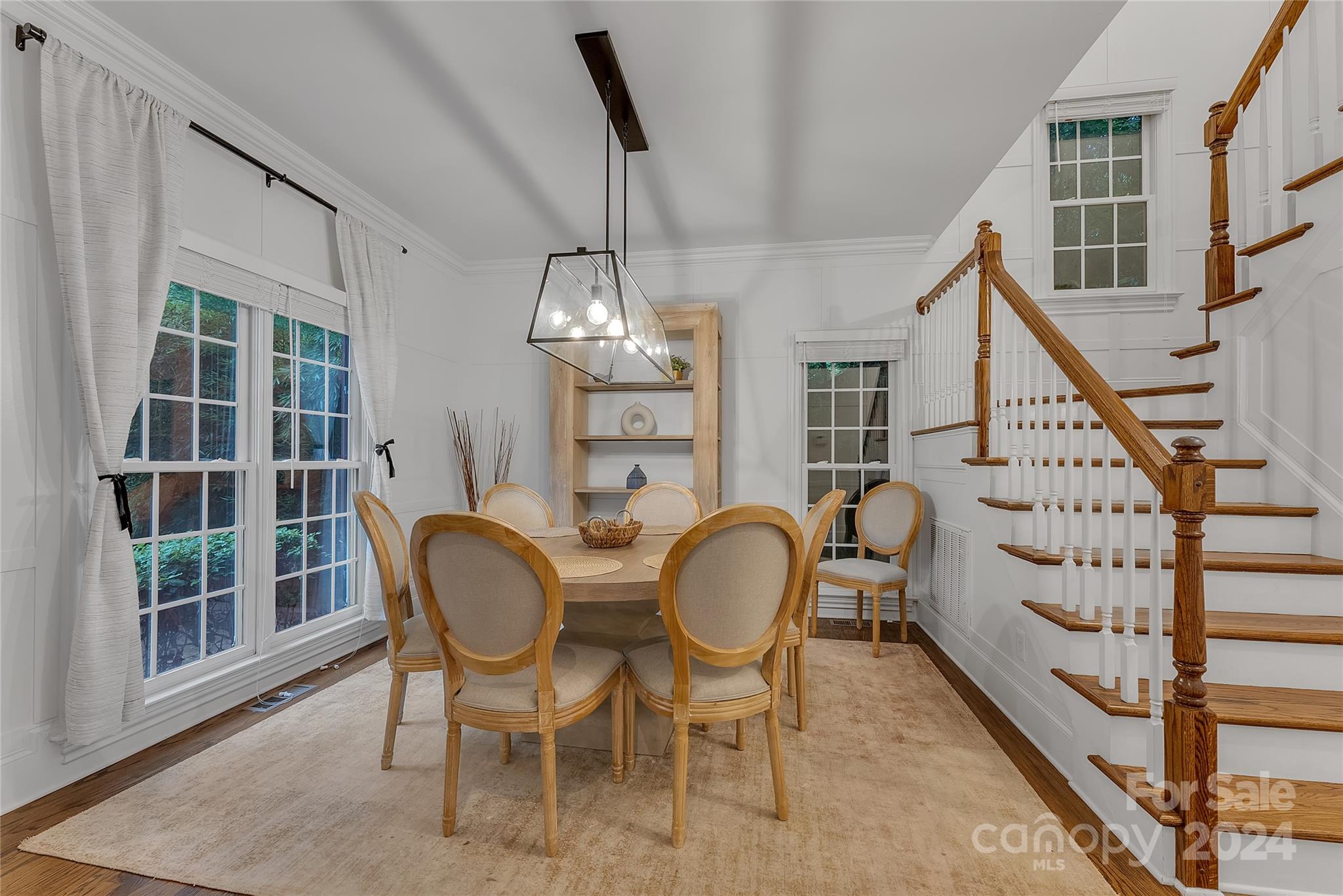 920 Millbrook Road Charlotte, NC 28211 - Photo 8 of 48 a view of a dining room with furniture and wooden floor