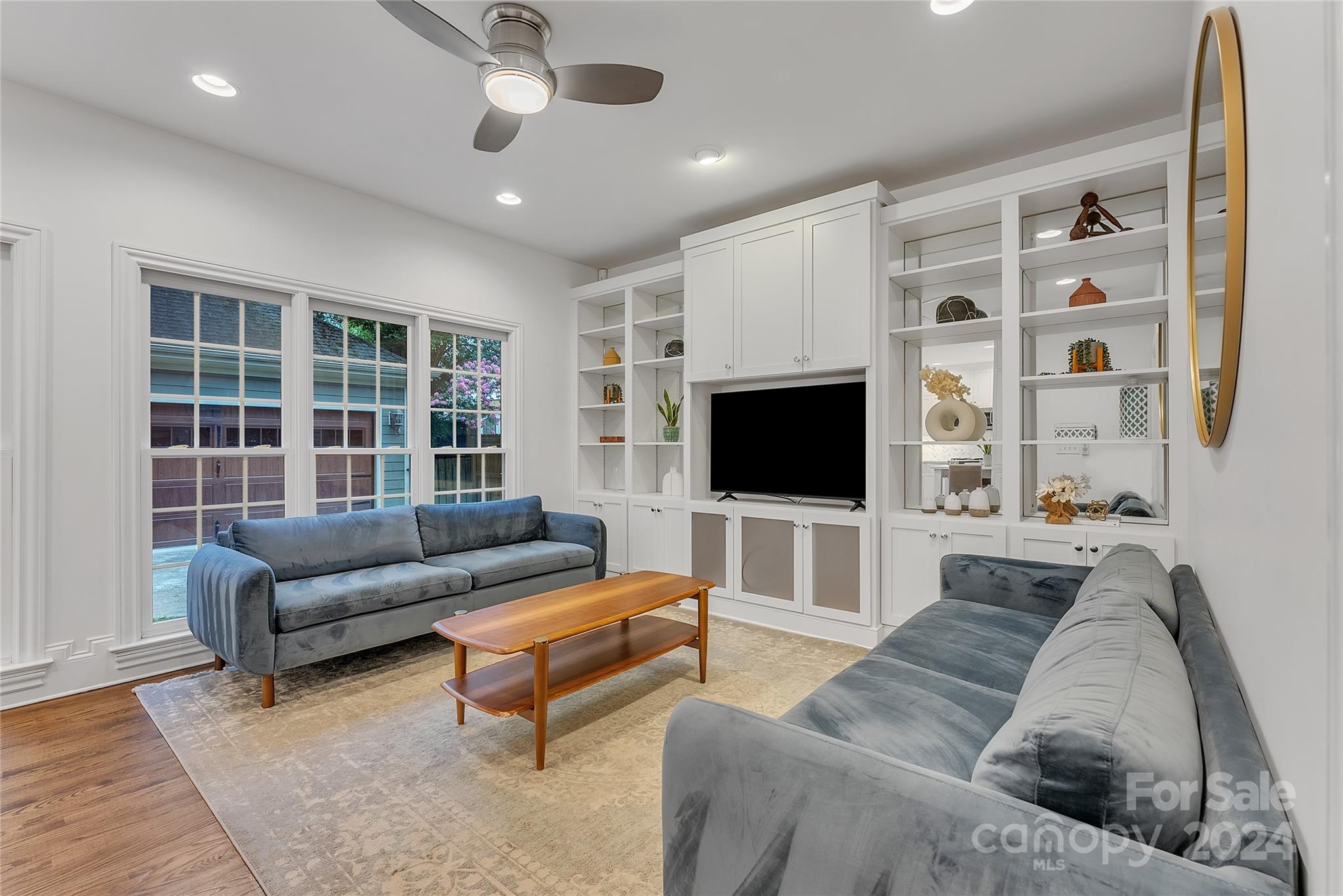 920 Millbrook Road Charlotte, NC 28211 - Photo 10 of 48 a living room with furniture and a flat screen tv