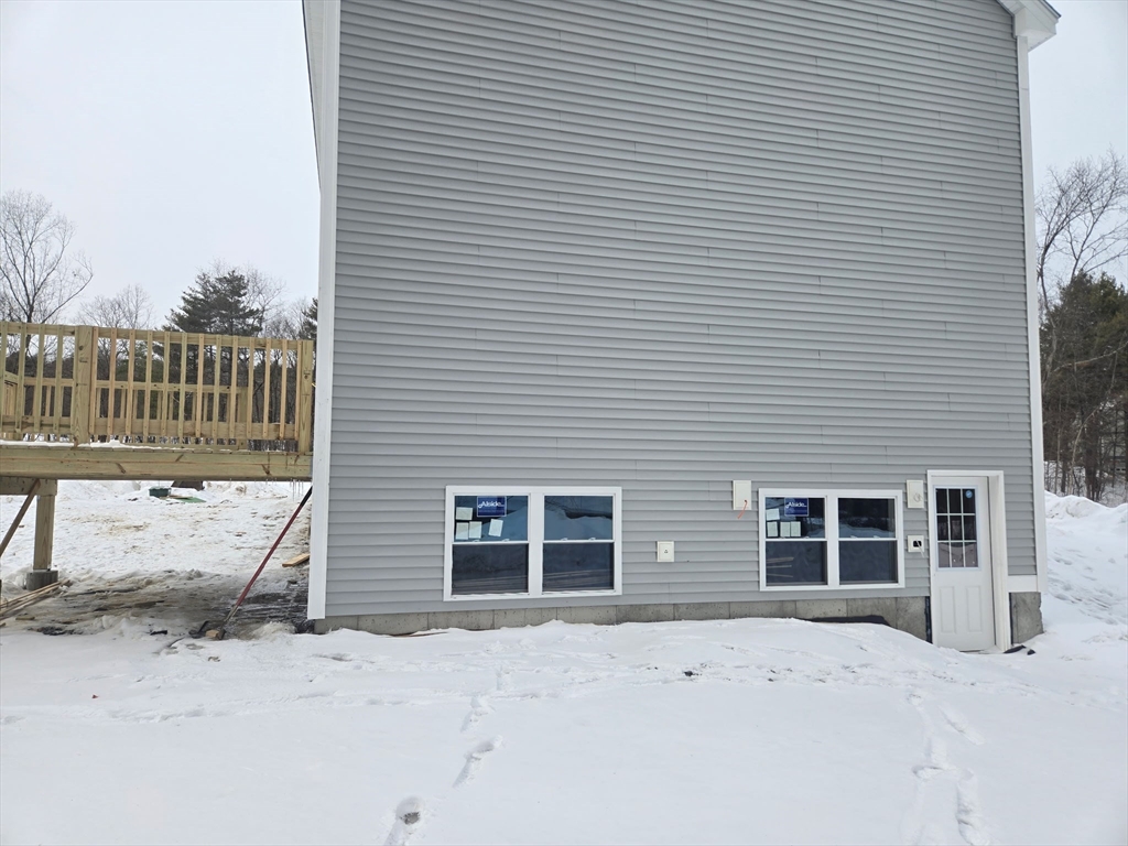 Lot 1 Patterson Road Shirley, MA 01464 - Photo 3 of 3 a front view of a house with a yard and garage