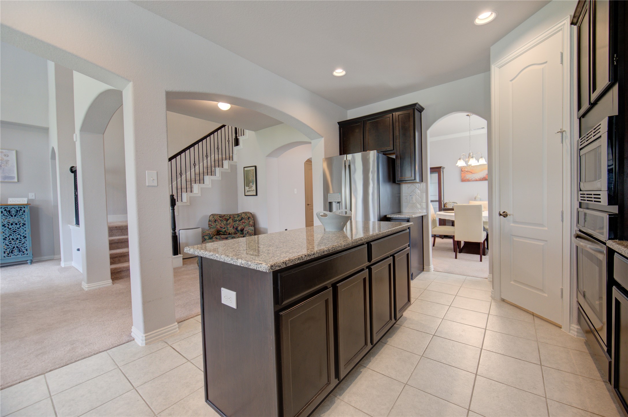 13838 Sturcombe Gln Trail Rosharon, TX 77583 - Photo 13 of 44 a kitchen with stainless steel appliances granite countertop a refrigerator and a sink