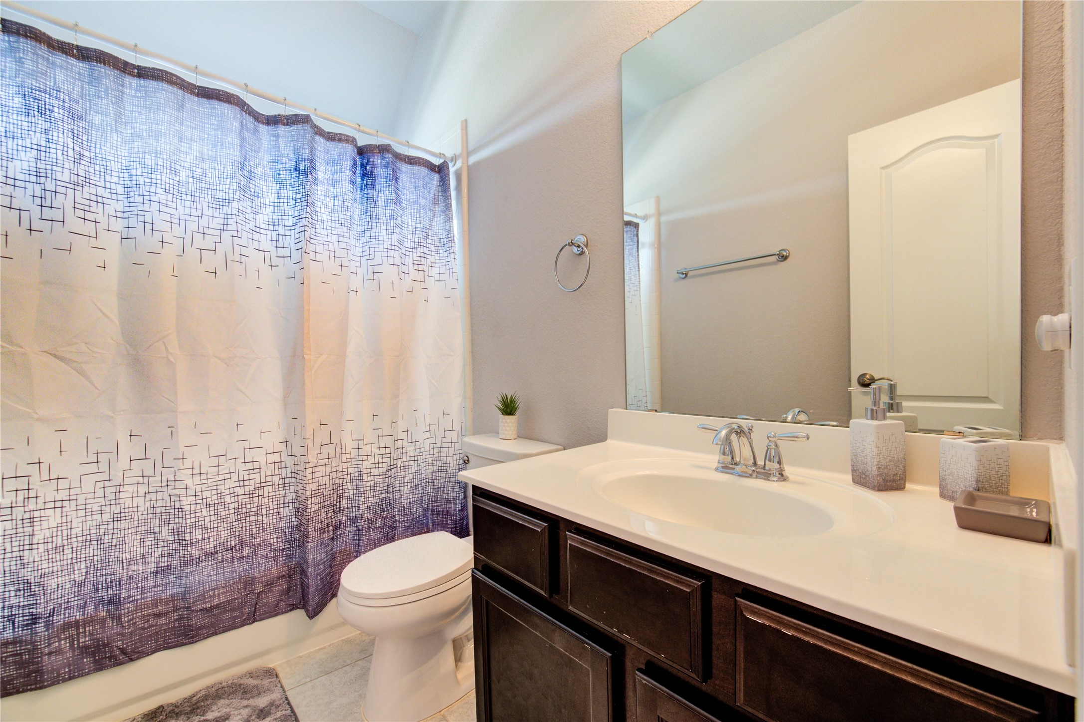 13838 Sturcombe Gln Trail Rosharon, TX 77583 - Photo 36 of 44 a bathroom with a sink a toilet and shower curtain