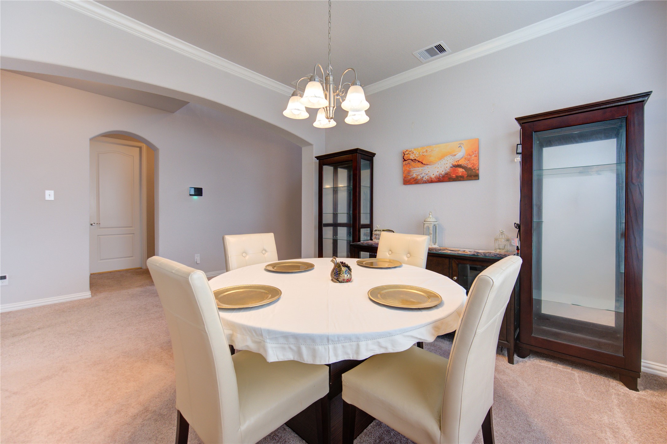 13838 Sturcombe Gln Trail Rosharon, TX 77583 - Photo 9 of 44 a view of a dining room with furniture and chandelier