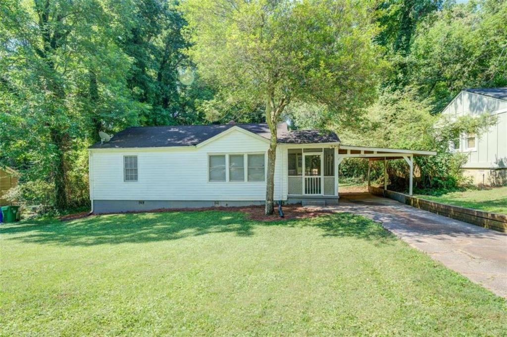 3560 Orchard Circle Decatur, GA 30032 - Photo 1 of 1 a view of a house with a yard and sitting area