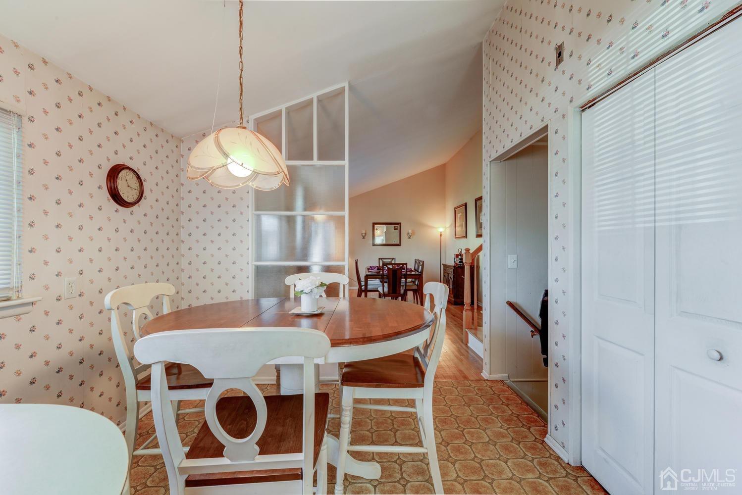 85 Albemarle Road Colonia, NJ 07067 - Photo 15 of 29 a view of a dining room with furniture and wooden floor