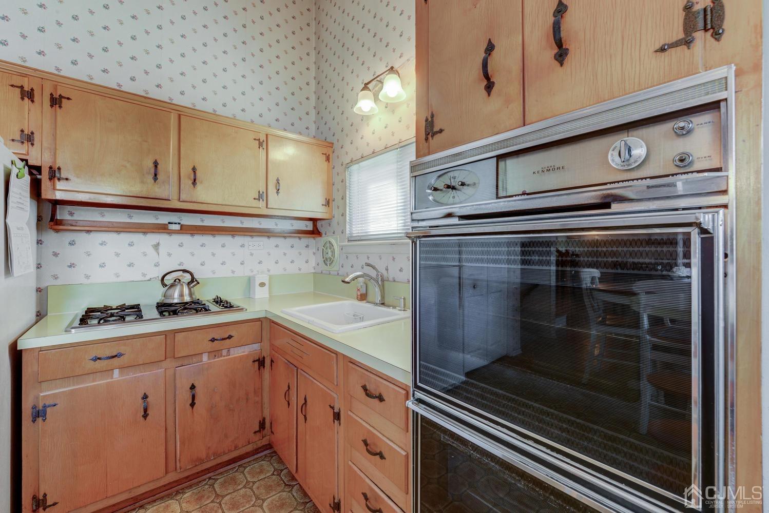 85 Albemarle Road Colonia, NJ 07067 - Photo 16 of 29 a kitchen with granite countertop cabinets stainless steel appliances and sink