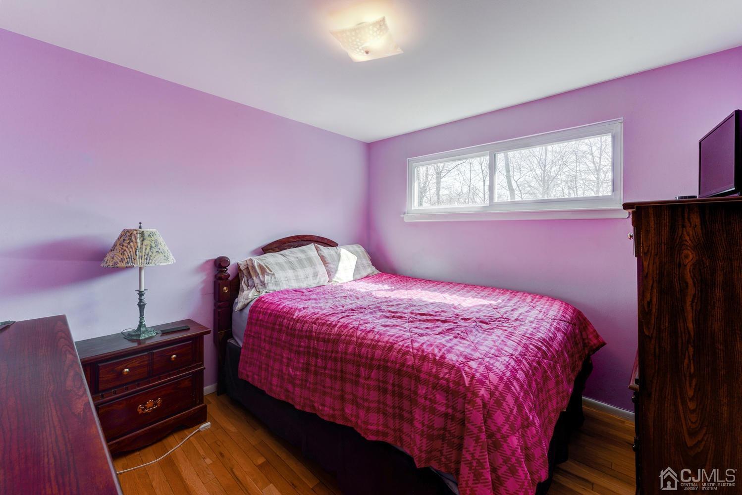 85 Albemarle Road Colonia, NJ 07067 - Photo 20 of 29 a bedroom with a bed and a window