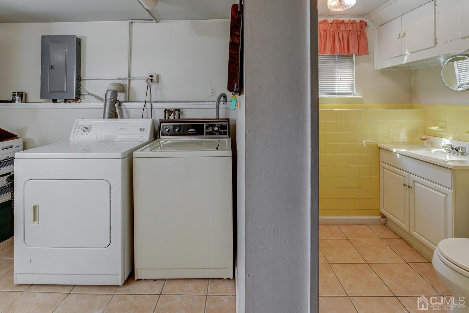 85 Albemarle Road Colonia, NJ 07067 - Photo 25 of 29 a utility room with dryer and washer