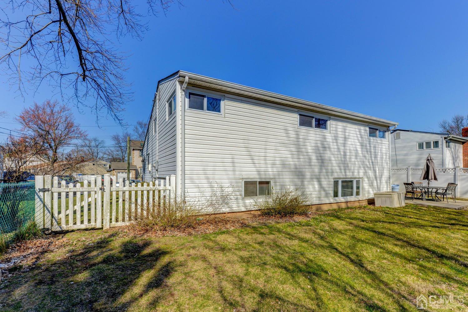 85 Albemarle Road Colonia, NJ 07067 - Photo 28 of 29 a front view of a house with a yard