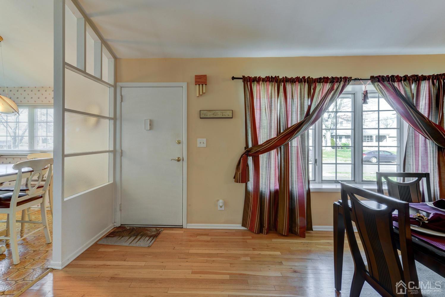 85 Albemarle Road Colonia, NJ 07067 - Photo 9 of 29 a view of an entryway with wooden floor and door