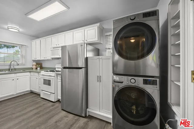 a kitchen with a washer and dryer