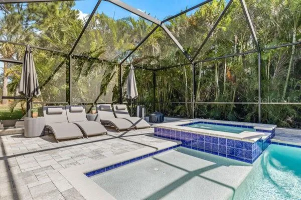 a view of a porch with a table and chairs