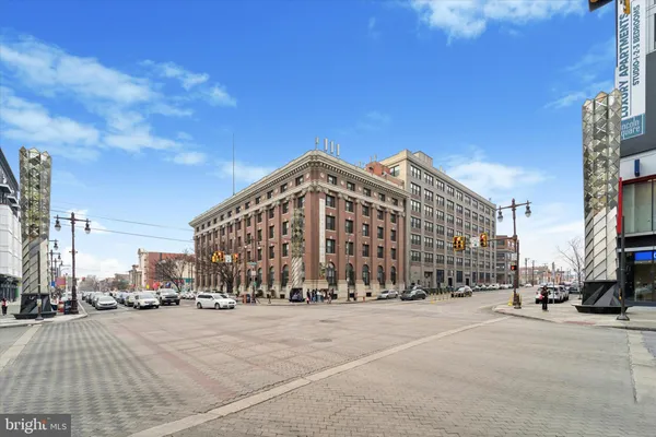 a large building with a street in the background