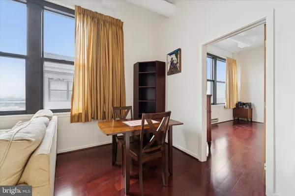 a view of a livingroom with furniture and a window