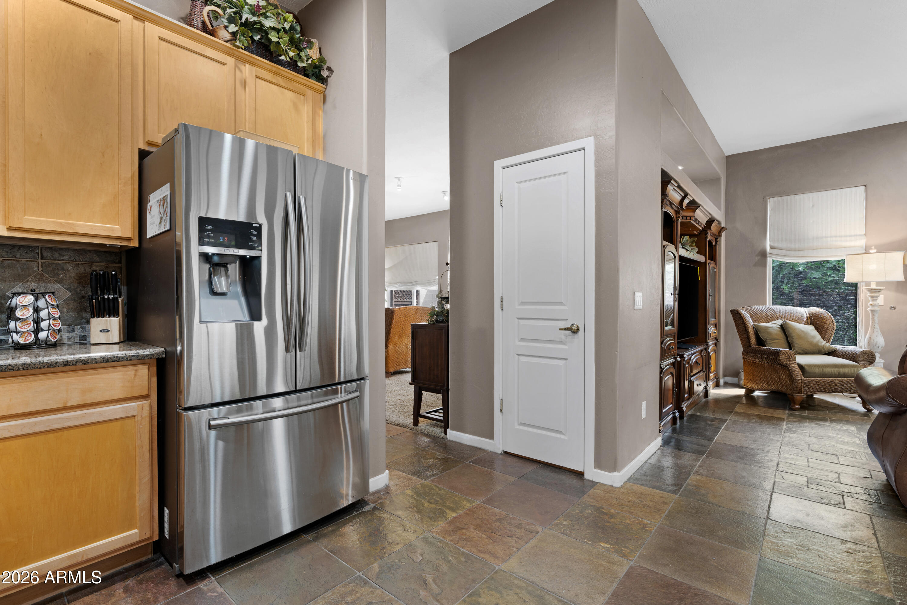 2107 East Beautiful Lane Phoenix, AZ 85042 - Photo 14 of 36 a metallic refrigerator freezer sitting in a kitchen