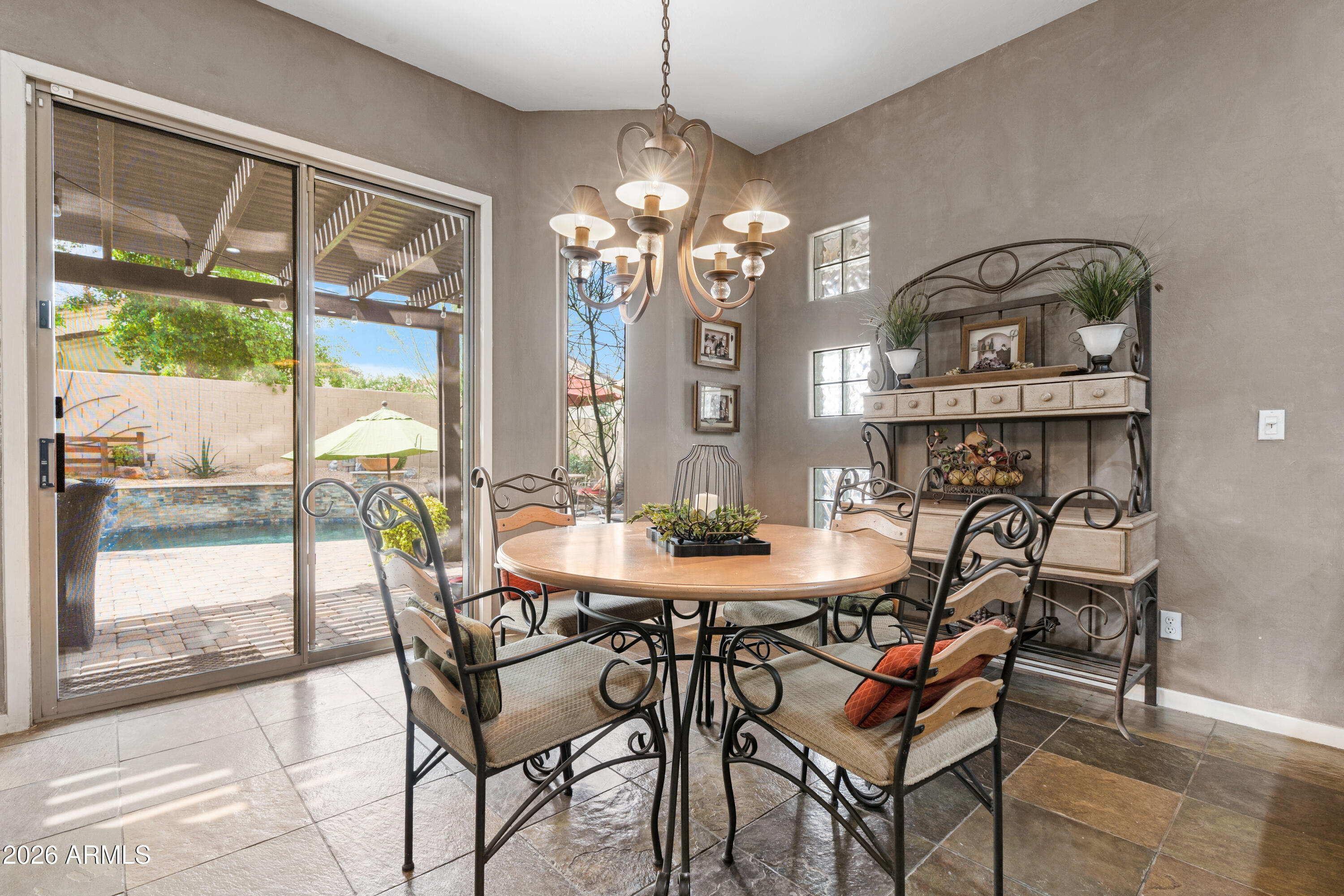 2107 East Beautiful Lane Phoenix, AZ 85042 - Photo 15 of 36 a view of a dining room with furniture window and outside view