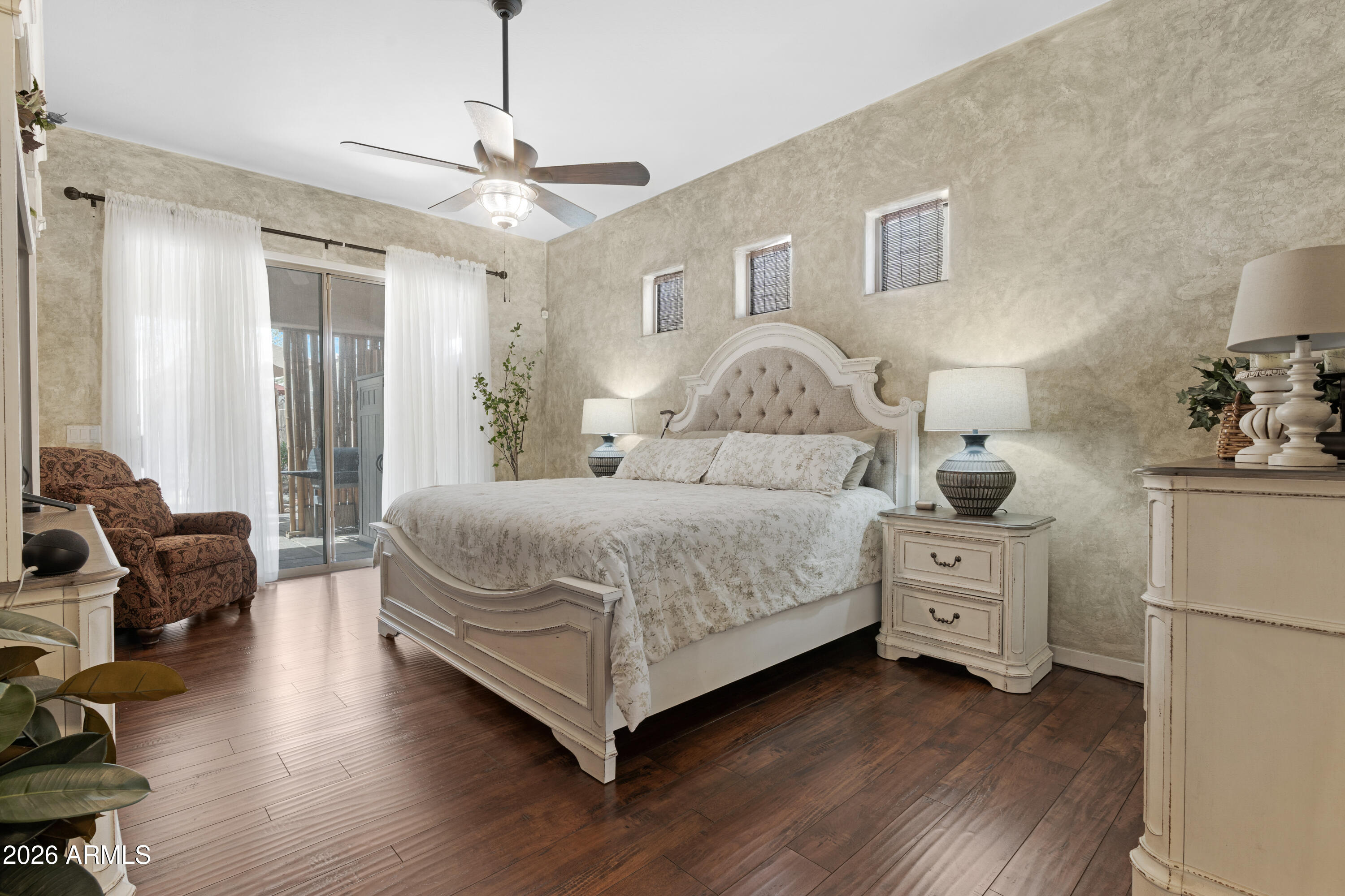 2107 East Beautiful Lane Phoenix, AZ 85042 - Photo 17 of 36 a bedroom with a bed and a couch
