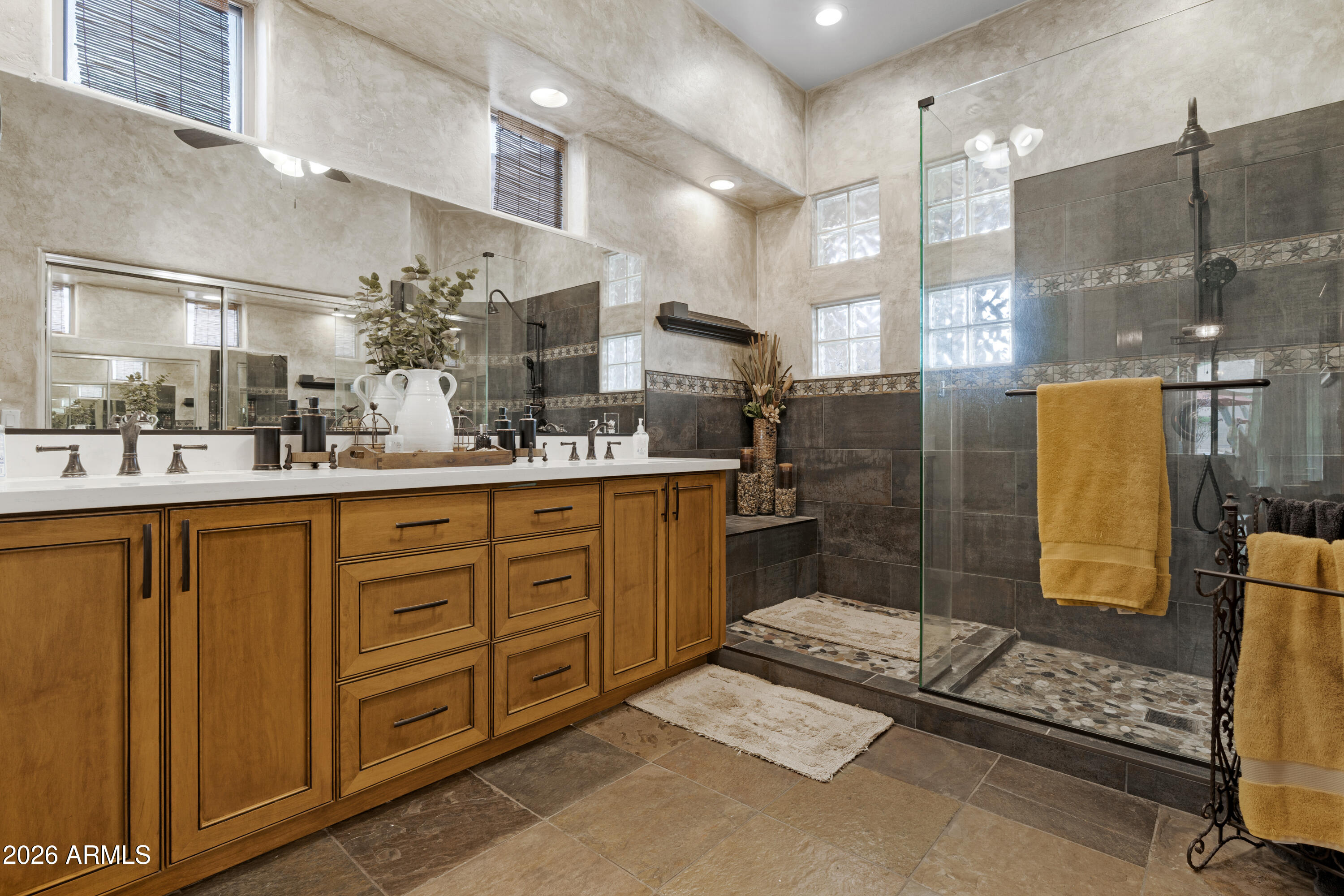 2107 East Beautiful Lane Phoenix, AZ 85042 - Photo 21 of 36 a bathroom with a sink mirror and shower
