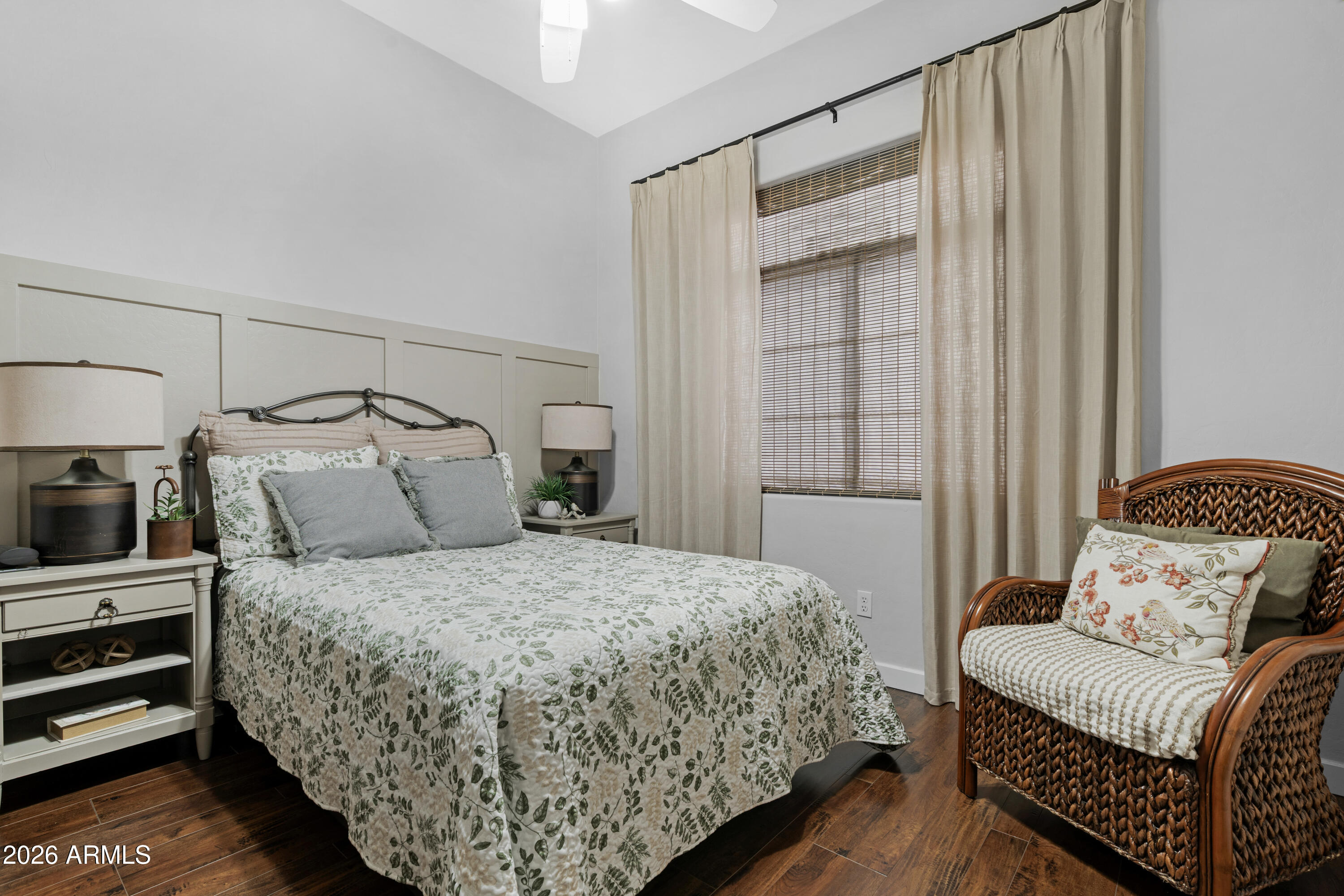 2107 East Beautiful Lane Phoenix, AZ 85042 - Photo 23 of 36 a bedroom with a bed and wooden floor