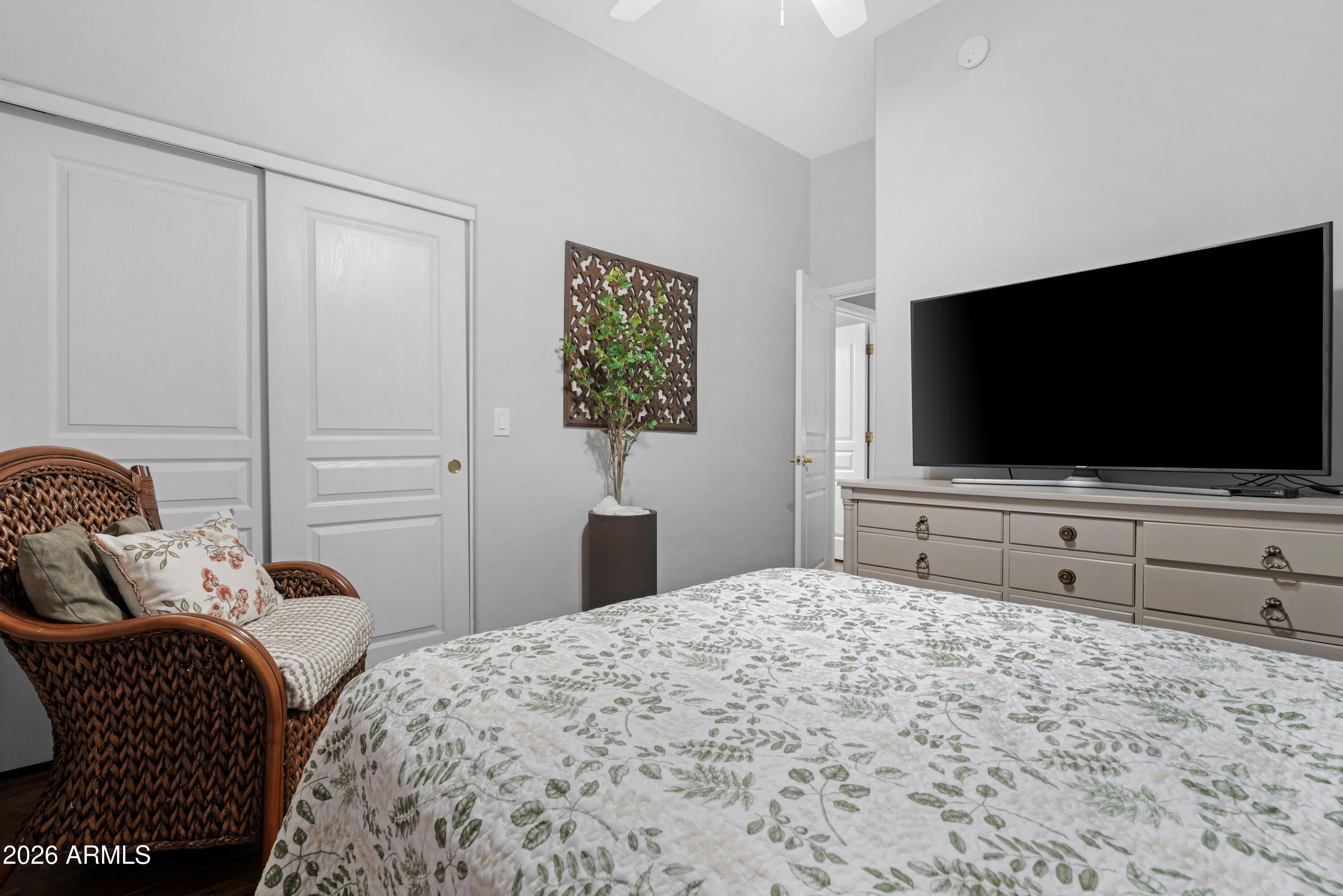 2107 East Beautiful Lane Phoenix, AZ 85042 - Photo 24 of 36 a bedroom with a bed and a flat screen tv