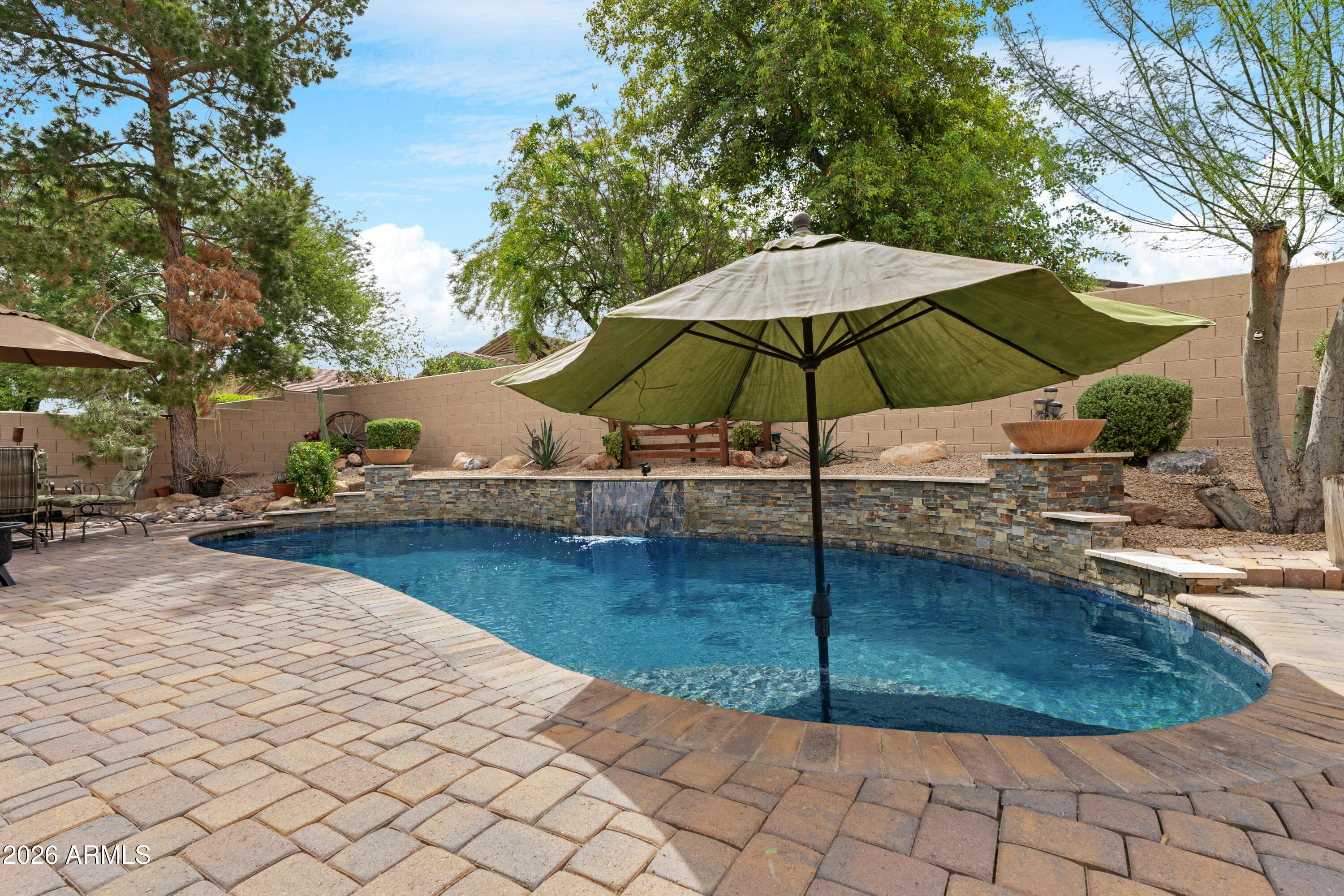 2107 East Beautiful Lane Phoenix, AZ 85042 - Photo 34 of 36 a backyard of a house with table and chairs