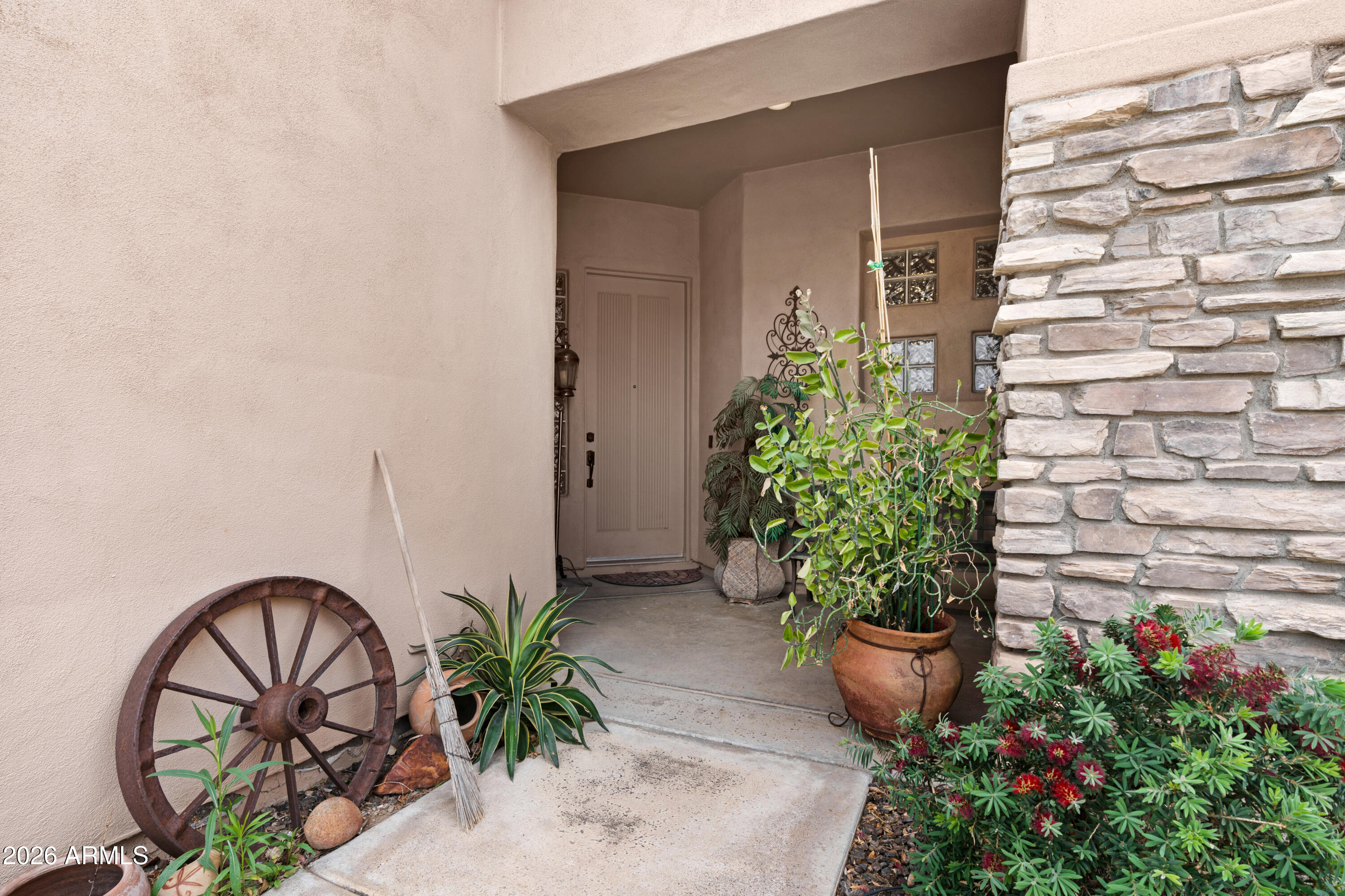 2107 East Beautiful Lane Phoenix, AZ 85042 - Photo 3 of 36 a potted plant sitting in front of a house