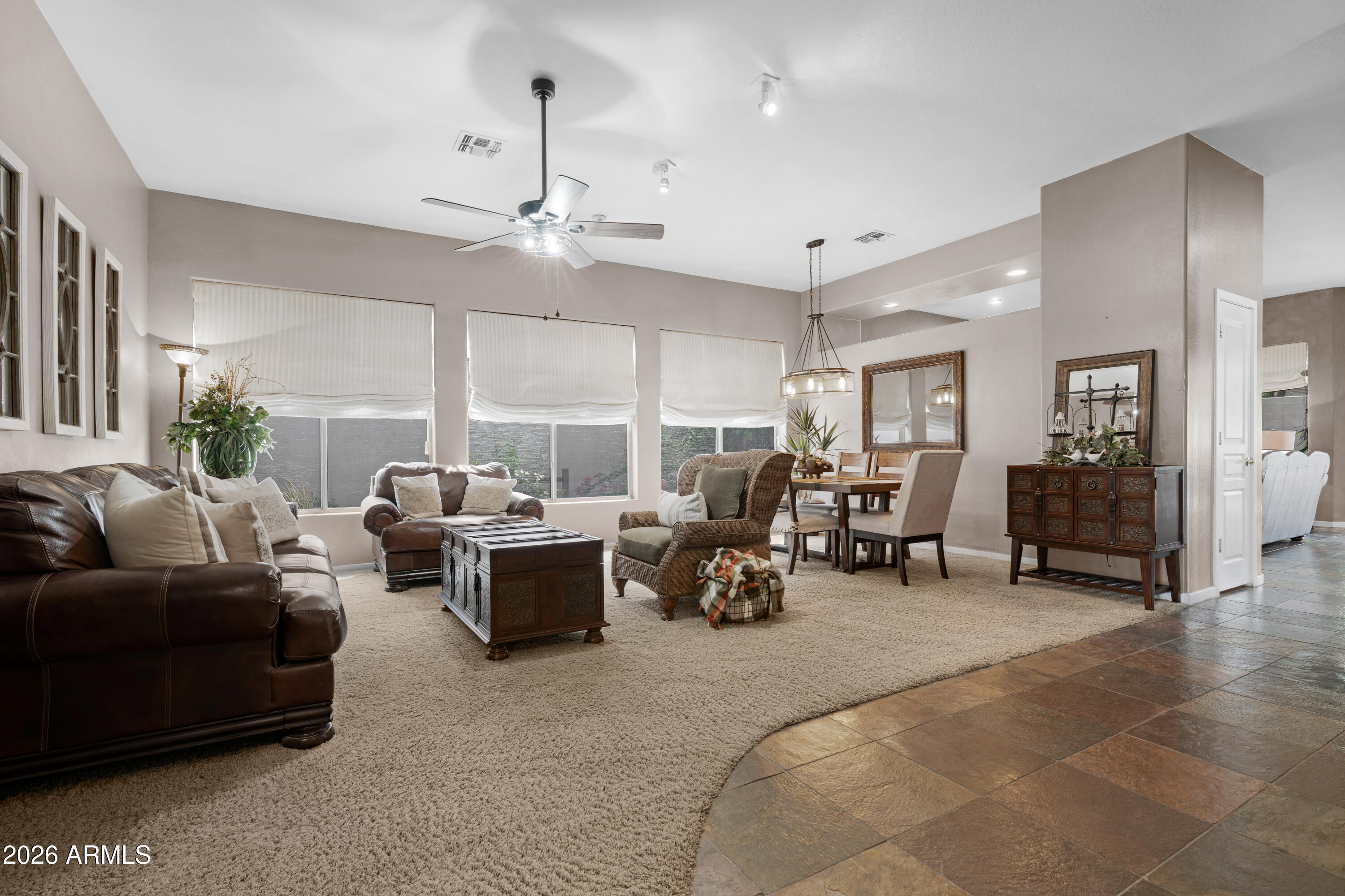 2107 East Beautiful Lane Phoenix, AZ 85042 - Photo 5 of 36 a living room with furniture and a chandelier