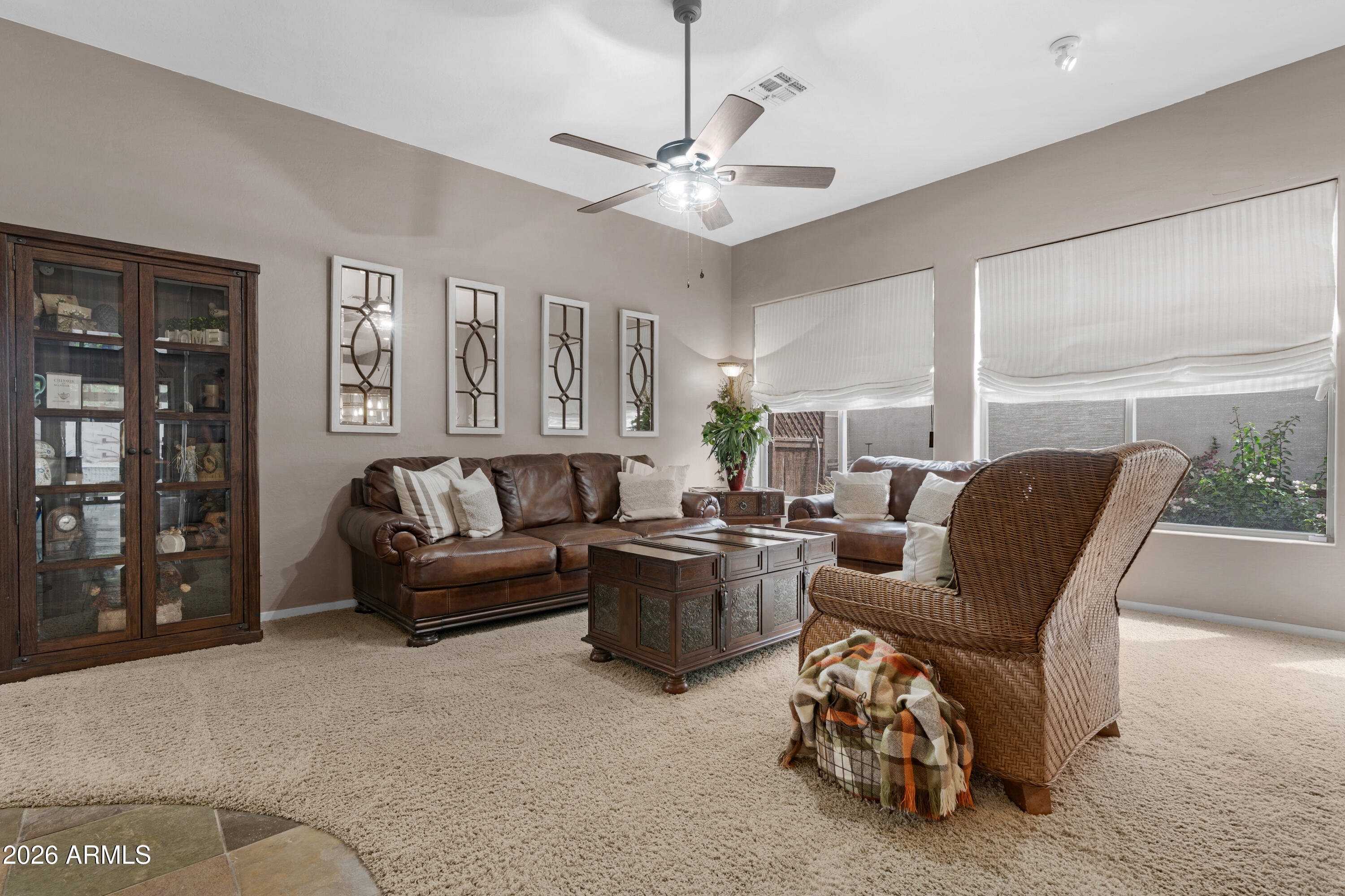 2107 East Beautiful Lane Phoenix, AZ 85042 - Photo 6 of 36 a living room with furniture and a chandelier