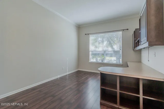 a view of entryway with wooden floor