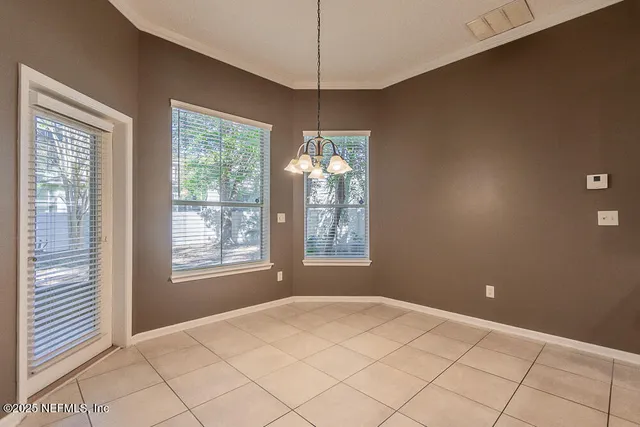 a kitchen with granite countertop a sink stove and refrigerator