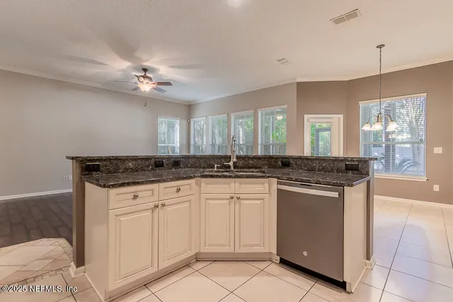 a view of a hallway with washer and dryer