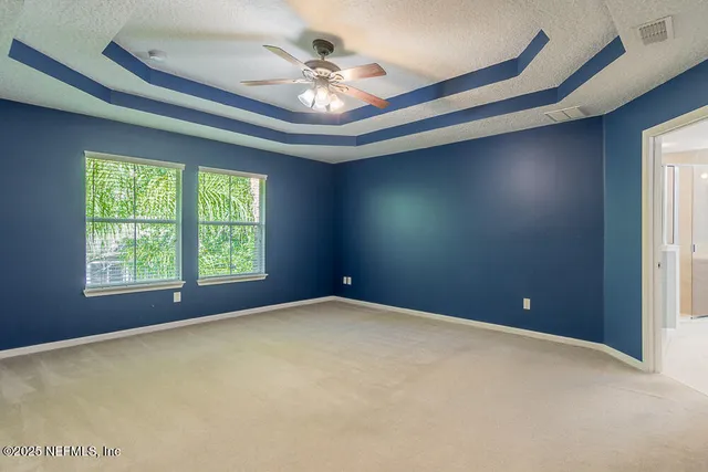 a bathroom with a shower sink and mirror