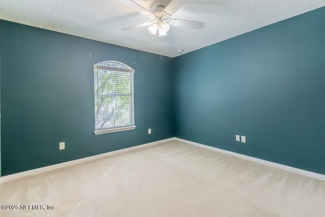 a bathroom with a shower sink and mirror