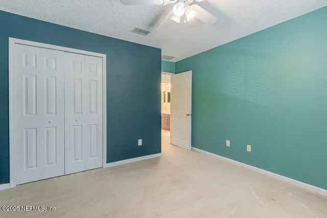 a white toilet sitting next to a bath tub and shower