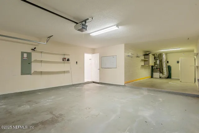 a view of a house with yard and a tree
