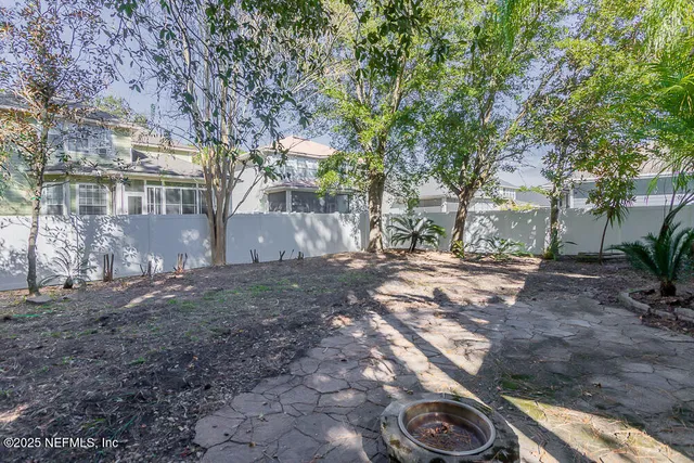 a view of a house with swimming pool and sitting area