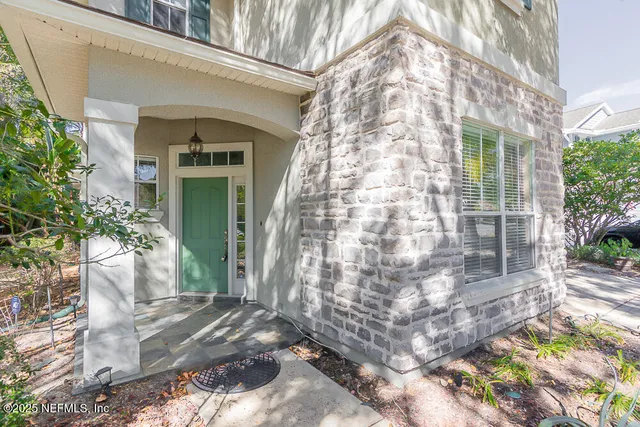 a workspace with wooden floor and a window