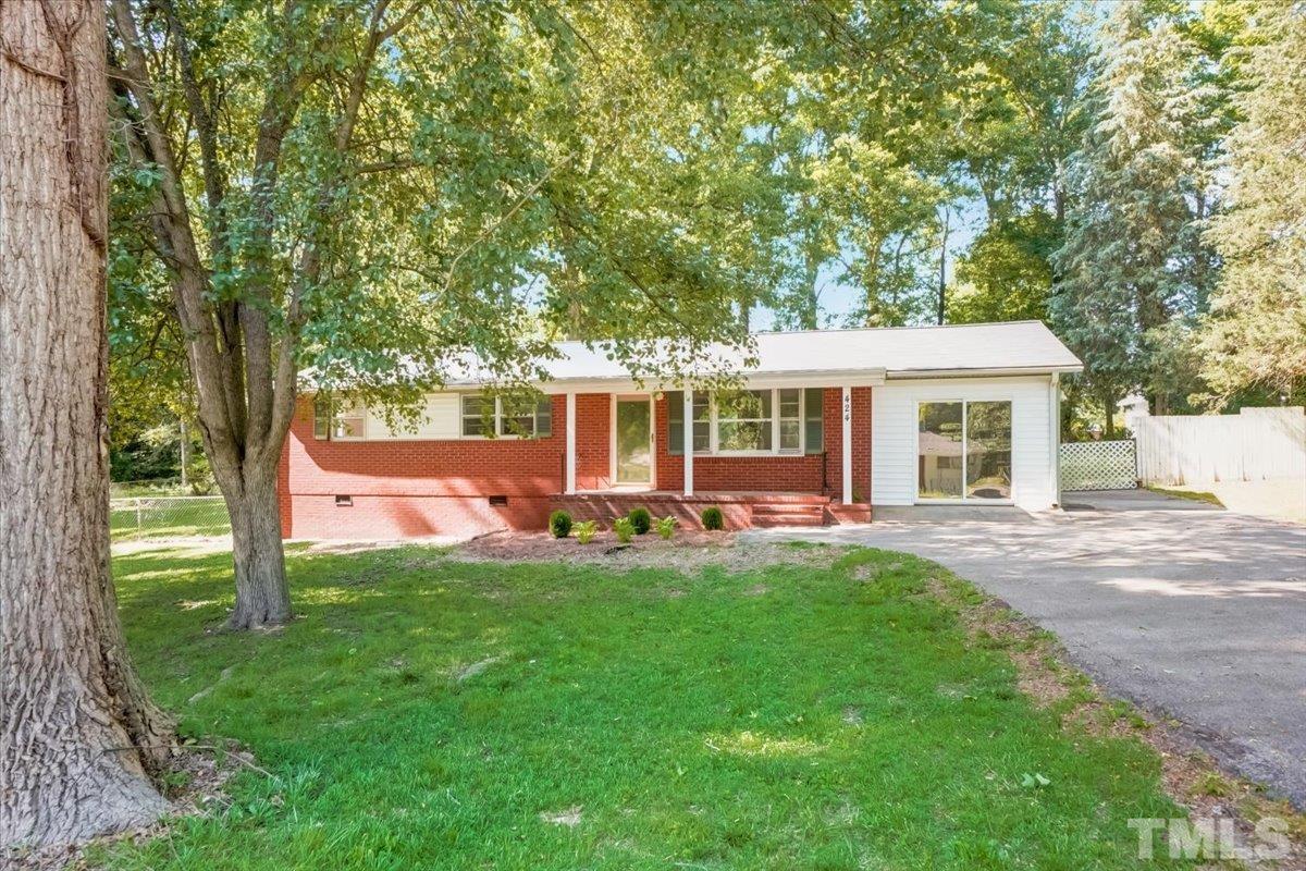 424 Grovemont Road Raleigh, NC 27603 - Photo 1 of 23 front view of a house with a yard