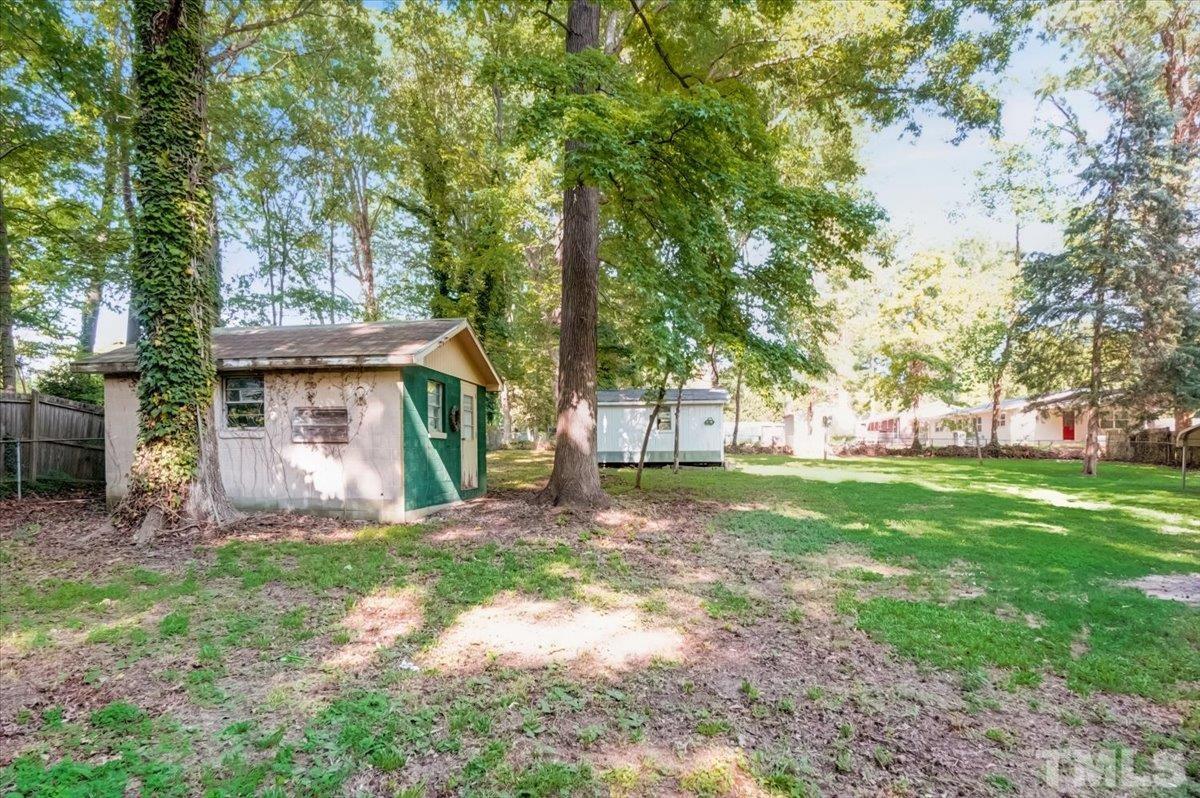 424 Grovemont Road Raleigh, NC 27603 - Photo 21 of 23 a view of a house with a yard and tree s