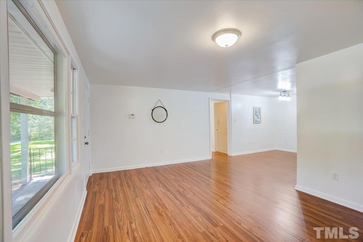 424 Grovemont Road Raleigh, NC 27603 - Photo 6 of 23 a view of empty room with wooden floor