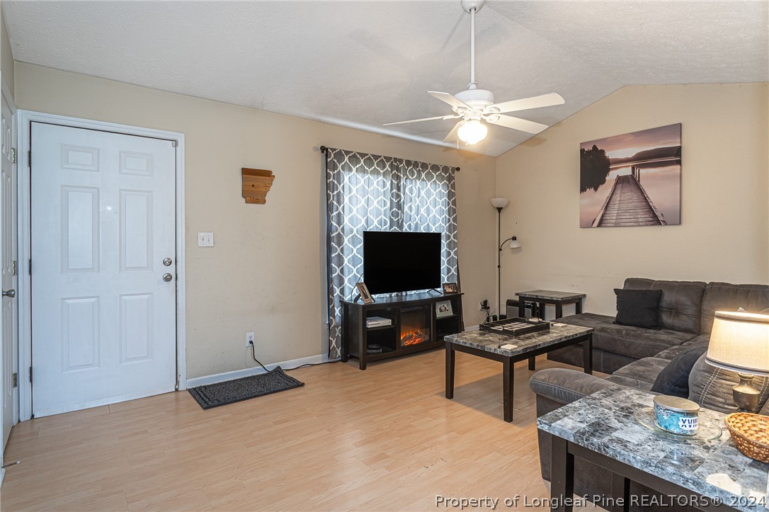 1955 Christopher Way Fayetteville, NC 28303 - Photo 3 of 35 a living room with furniture and a flat screen tv
