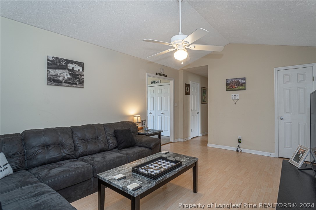 1955 Christopher Way Fayetteville, NC 28303 - Photo 5 of 35 a living room with furniture and a chandelier
