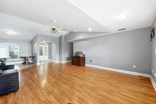a view of a room with furniture and window